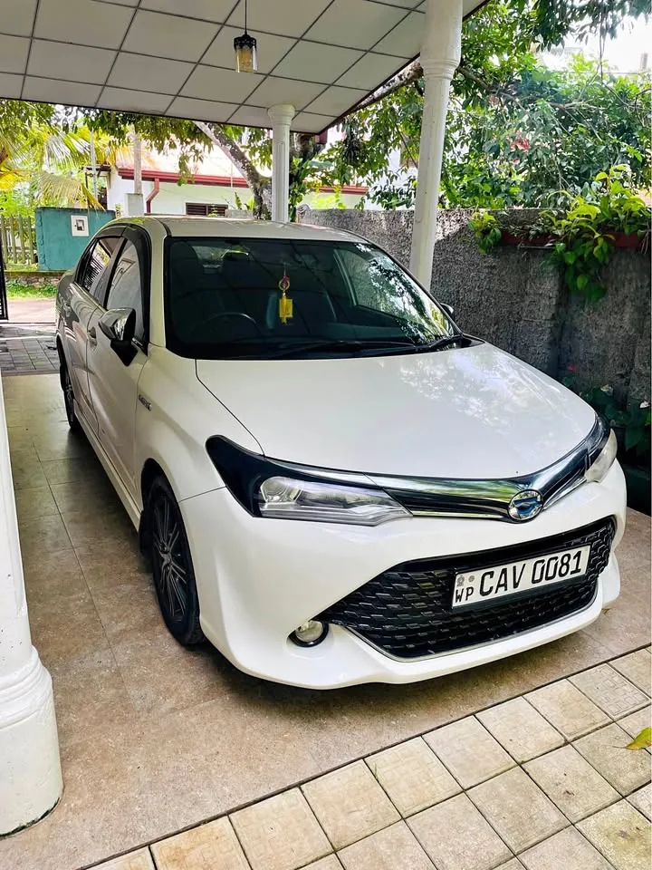 White sedan used for airport transfers in Sri Lanka